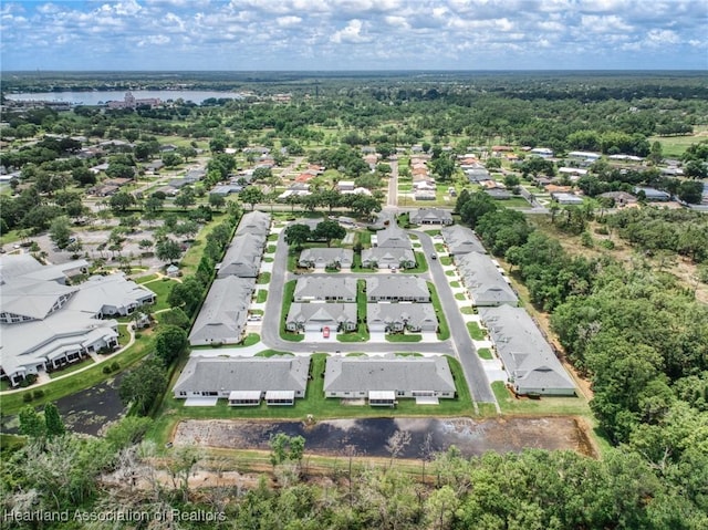 2036 Ashley Oaks Cir, Sebring, FL 33870 - aerial view of property and surrounding area with nearby suburban area and a large body of water