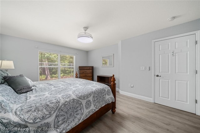 2036 Ashley Oaks Cir, Sebring, FL 33870 - bedroom with wood finished floors and baseboards