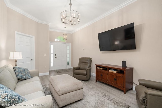 2036 Ashley Oaks Cir, Sebring, FL 33870 - living area with a chandelier, light wood-style floors, ornamental molding, and baseboards