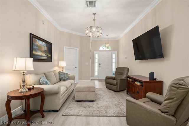 2036 Ashley Oaks Cir, Sebring, FL 33870 - living room with a chandelier, light wood-style floors, ornamental molding, and baseboards