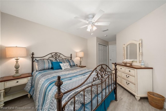 2036 Ashley Oaks Cir, Sebring, FL 33870 - bedroom featuring light wood finished floors, a closet, and ceiling fan
