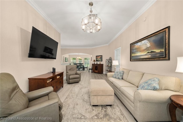2036 Ashley Oaks Cir, Sebring, FL 33870 - living area with a chandelier, arched walkways, wood finished floors, and crown molding
