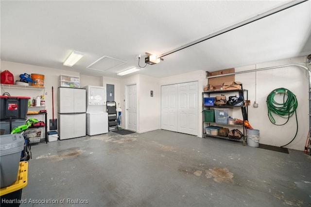 2036 Ashley Oaks Cir, Sebring, FL 33870 - garage featuring freestanding refrigerator, a garage door opener, and electric panel