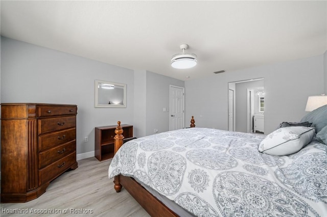 2036 Ashley Oaks Cir, Sebring, FL 33870 - bedroom featuring light wood-style floors and baseboards