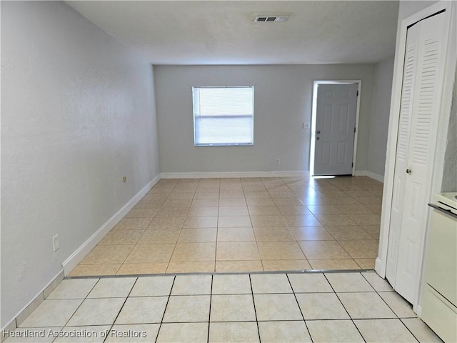 unfurnished room featuring light tile patterned floors