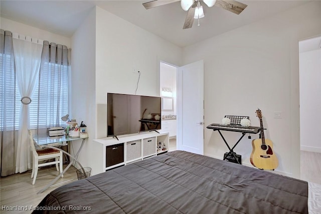 bedroom with ceiling fan and wood-type flooring