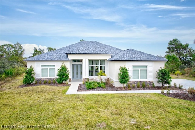 rear view of property with a lawn