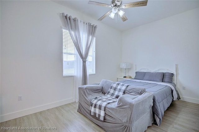 bedroom featuring ceiling fan and light wood-type flooring