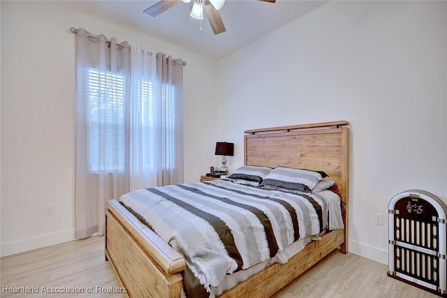 bedroom featuring ceiling fan and light hardwood / wood-style floors