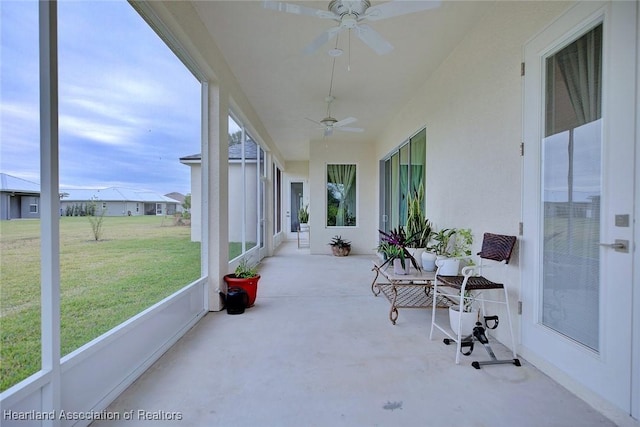 sunroom / solarium with ceiling fan