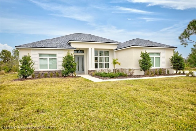 prairie-style house with a front lawn