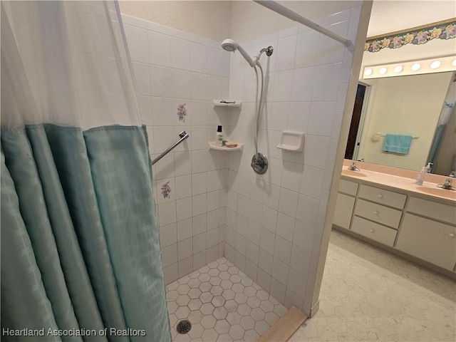 bathroom with vanity and curtained shower