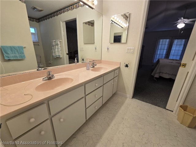 bathroom featuring tile patterned floors, ceiling fan, vanity, and toilet