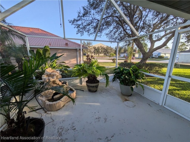 unfurnished sunroom featuring a healthy amount of sunlight