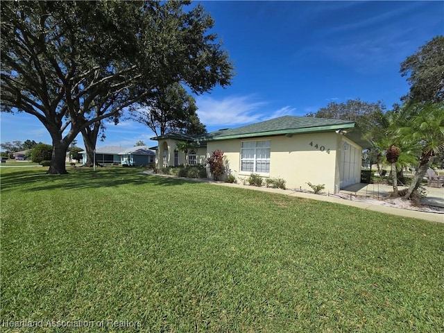 exterior space with a front lawn