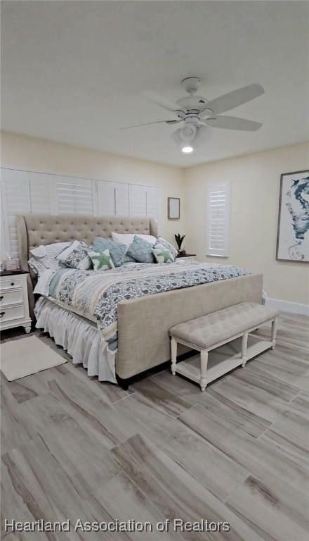 325 Anderson St NE, Lake Placid, FL 33852 - bedroom with ceiling fan and light hardwood / wood-style flooring