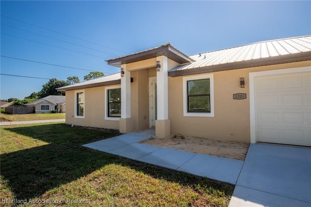 ranch-style house with a front lawn and a garage