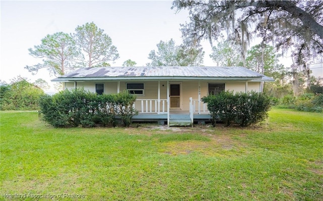 ranch-style home with a front lawn