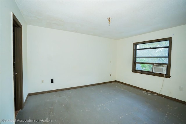 unfurnished room with concrete flooring and cooling unit