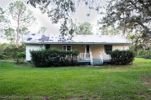 ranch-style house with a front lawn