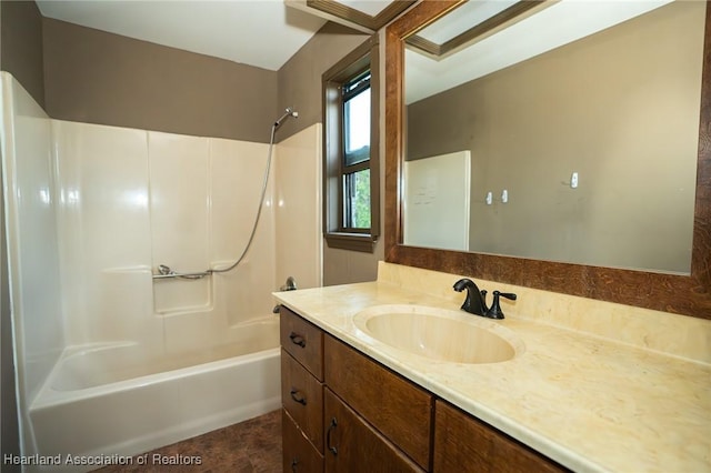 bathroom with shower / bathing tub combination and vanity