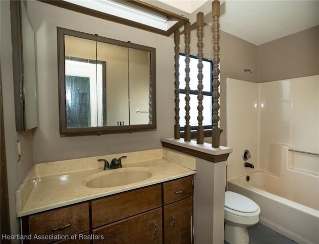 full bathroom with toilet, vanity, plenty of natural light, and tub / shower combination