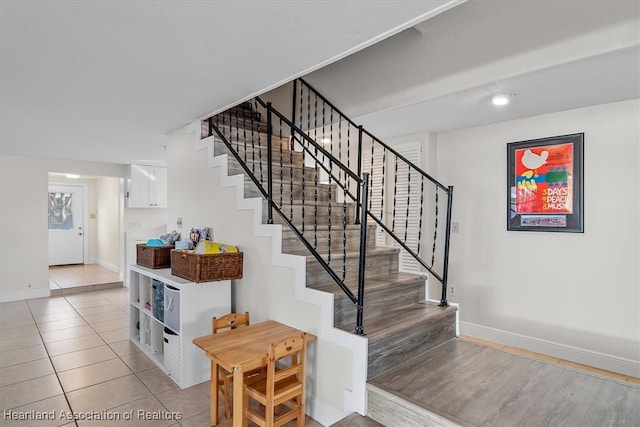 stairs with tile patterned flooring