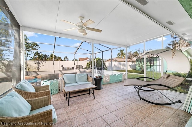 sunroom featuring ceiling fan