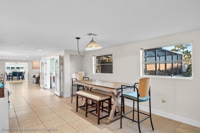 dining space with light tile patterned floors