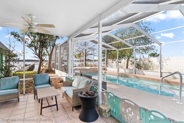 exterior space featuring an outdoor hangout area, ceiling fan, and glass enclosure