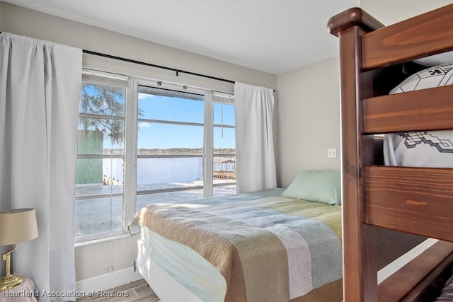 bedroom with wood-type flooring