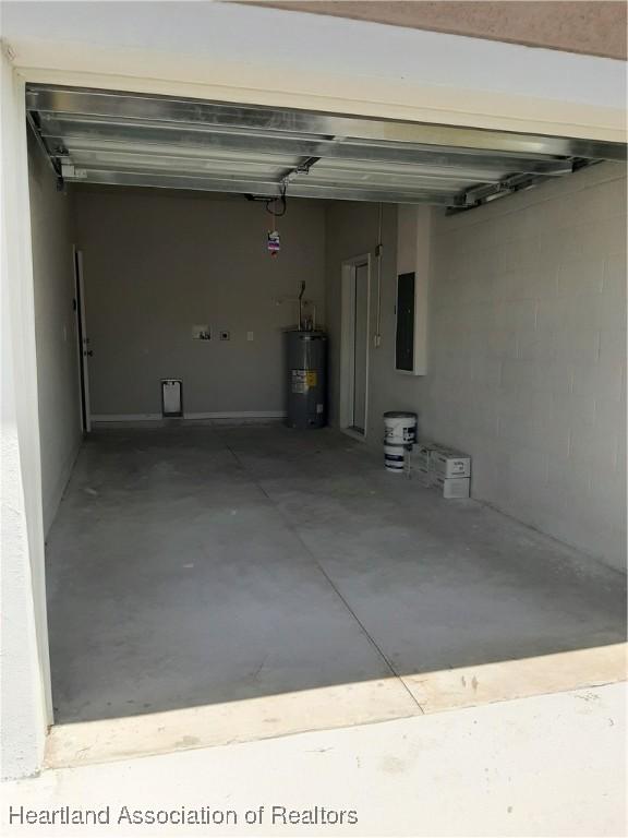 1508 Las Villas Blvd, Sebring, FL 33870 - garage with electric water heater and electric panel