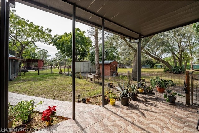 view of patio / terrace featuring a storage shed