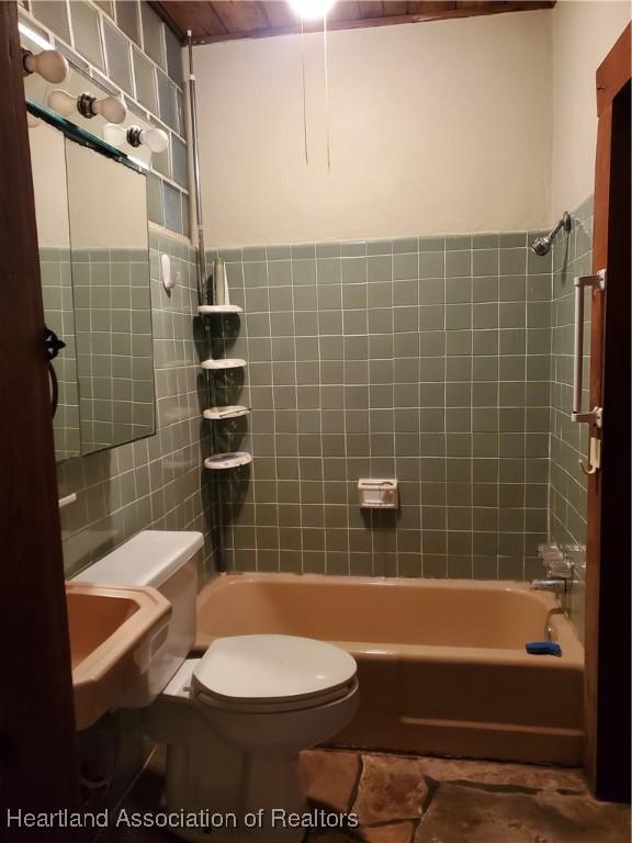 12115 S US Highway 41, Gibsonton, FL 33534 - full bath featuring tile walls and  shower combination