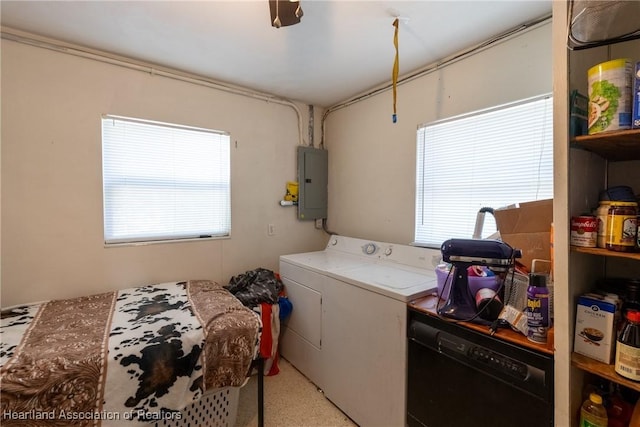 clothes washing area featuring electric panel, separate washer and dryer, and laundry area