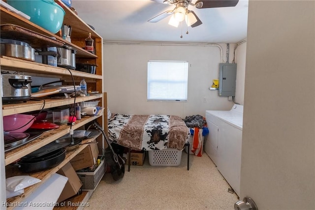 storage room featuring independent washer and dryer, electric panel, and a ceiling fan