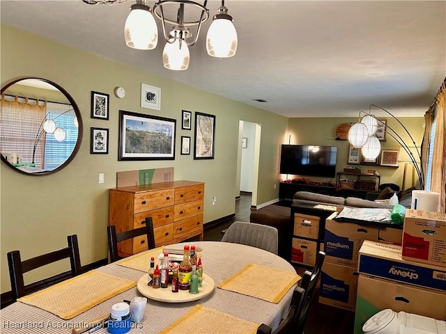 dining room featuring a notable chandelier