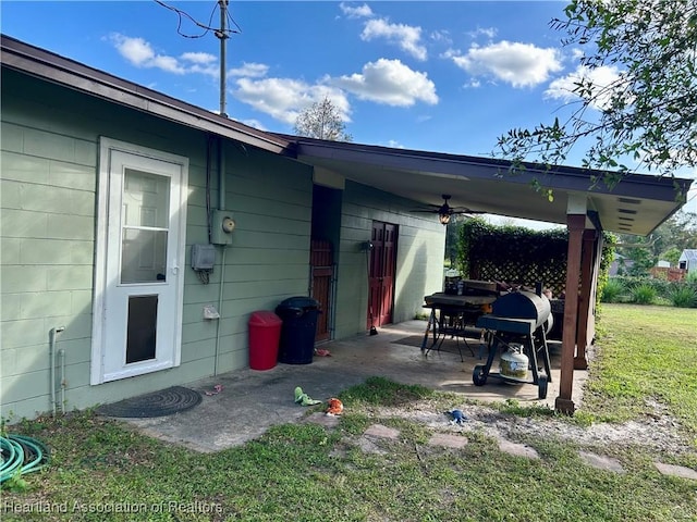 exterior space with ceiling fan and area for grilling