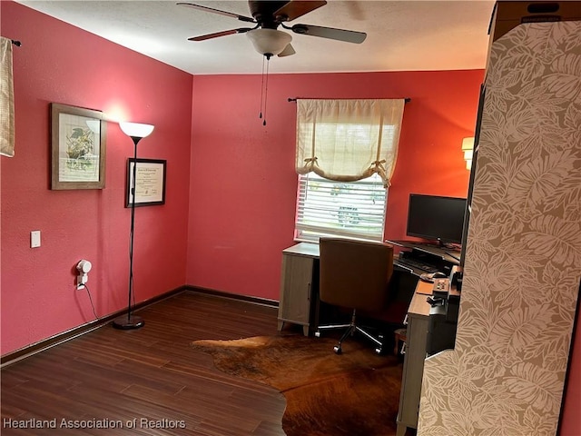 unfurnished office featuring ceiling fan and dark wood-type flooring