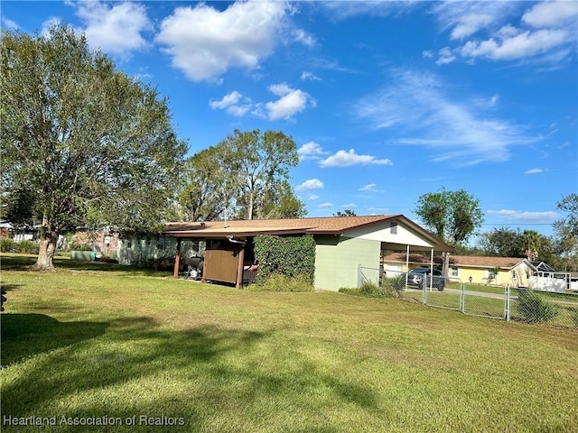 back of house with a lawn