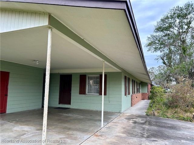 view of property exterior with a carport