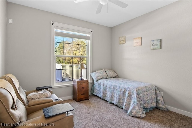 bedroom featuring light carpet and ceiling fan