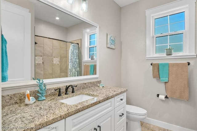 bathroom featuring vanity, toilet, curtained shower, and tile patterned flooring