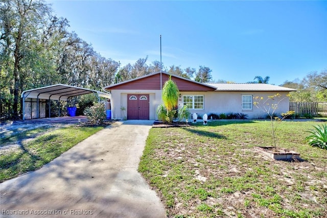 ranch-style home featuring a front lawn and a carport