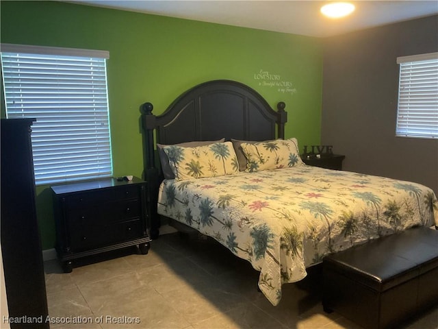 bedroom with light tile patterned flooring