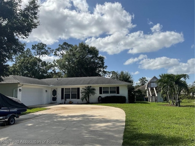 view of front of property with a garage and a front yard