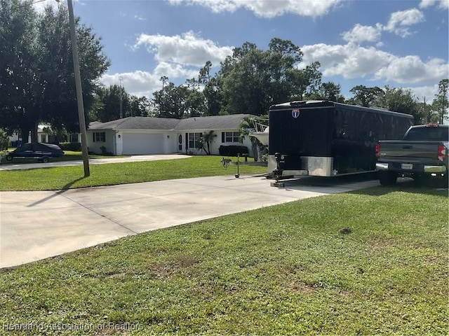 view of front of house with a garage and a front yard