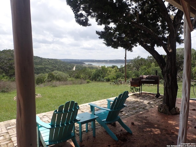 view of terrace featuring a water view