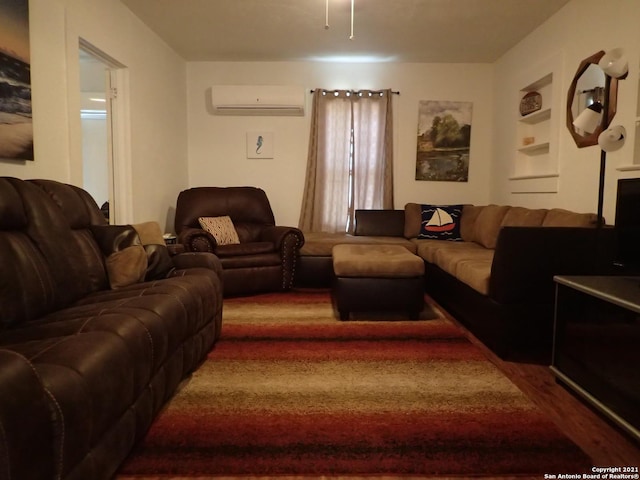 living room featuring dark hardwood / wood-style floors and a wall unit AC