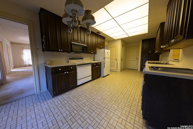 kitchen with an inviting chandelier, white appliances, and dark brown cabinetry